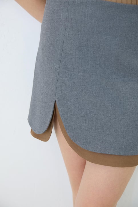Two-Tone Mini Skirt with Front Curve Detail